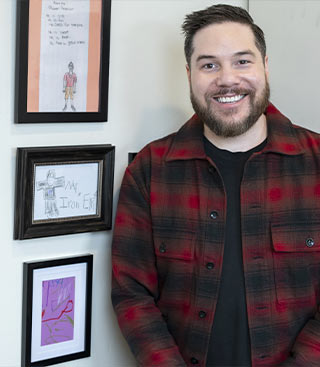 Dr Eric Bucher standing in his office