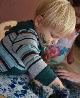 Toddler painting at the Family Enrichment Center