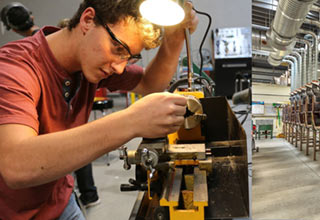 Student on grinding machine