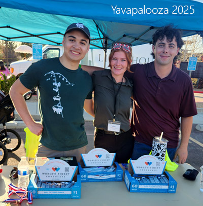 3 people at a carnival booth
